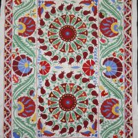 colourful embroidered pomegranates, flowers and vines grace this pretty textile