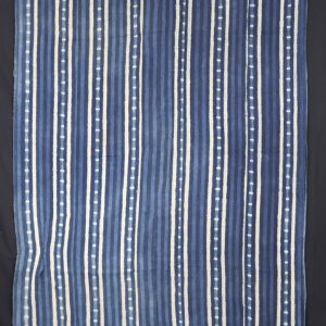 Resist dyed patterns on indigo coloured cotton cloth