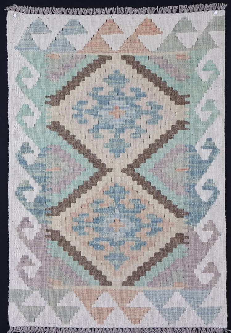 Multicolour Natural‑Dye Kilims • Dyed with pigments from fruits, vegetables, and spices. • Often brighter, with a more contemporary feel. • Typically woven in northern Afghanistan using Ghazni wool.