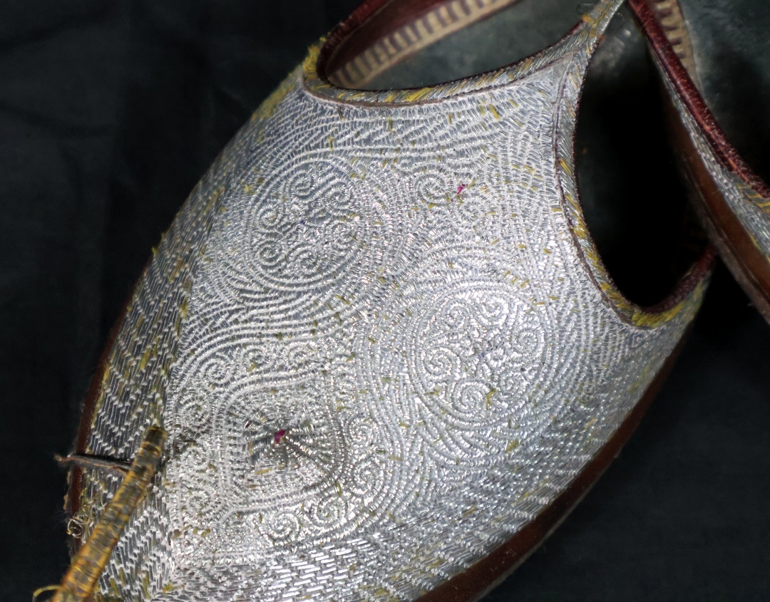 Intricately designed traditional footwear.