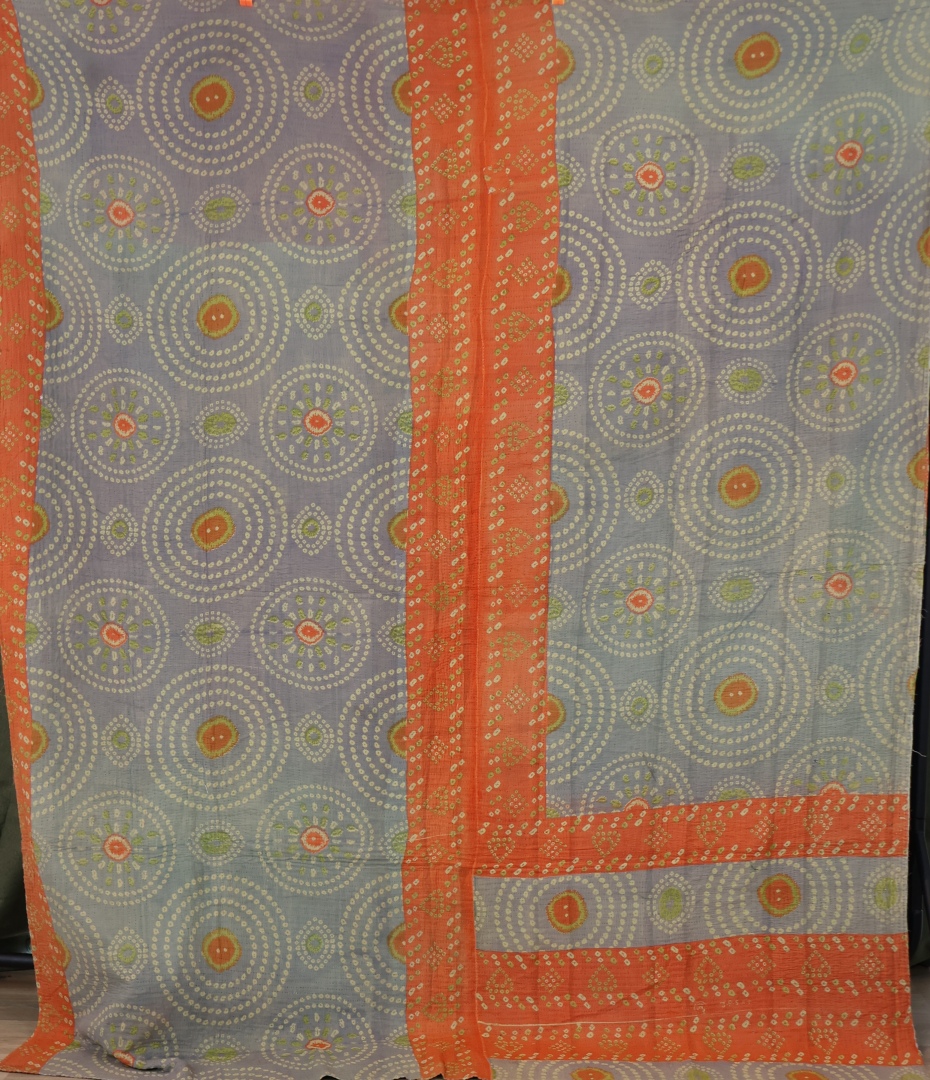 Vibrant green fabric with floral patterns