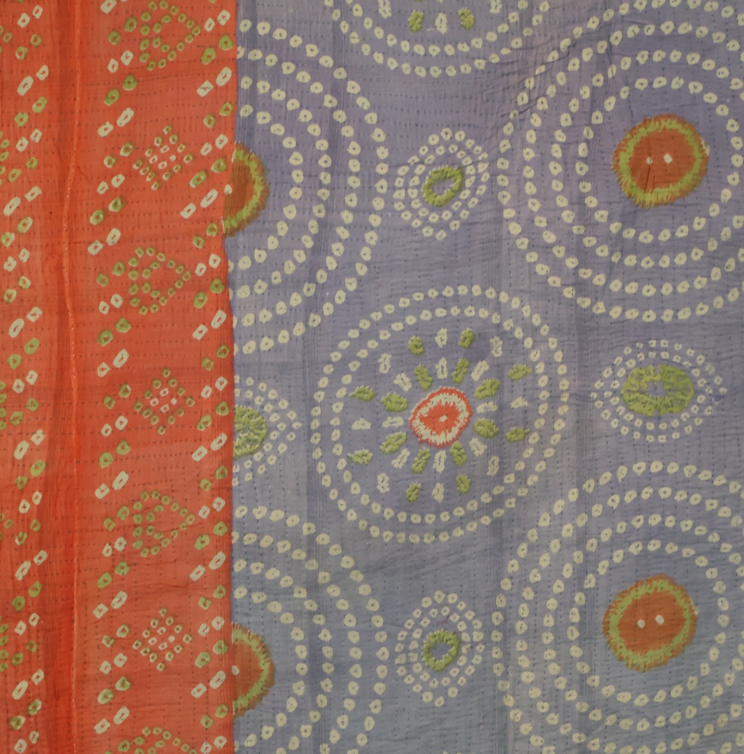 Vibrant green fabric with floral patterns