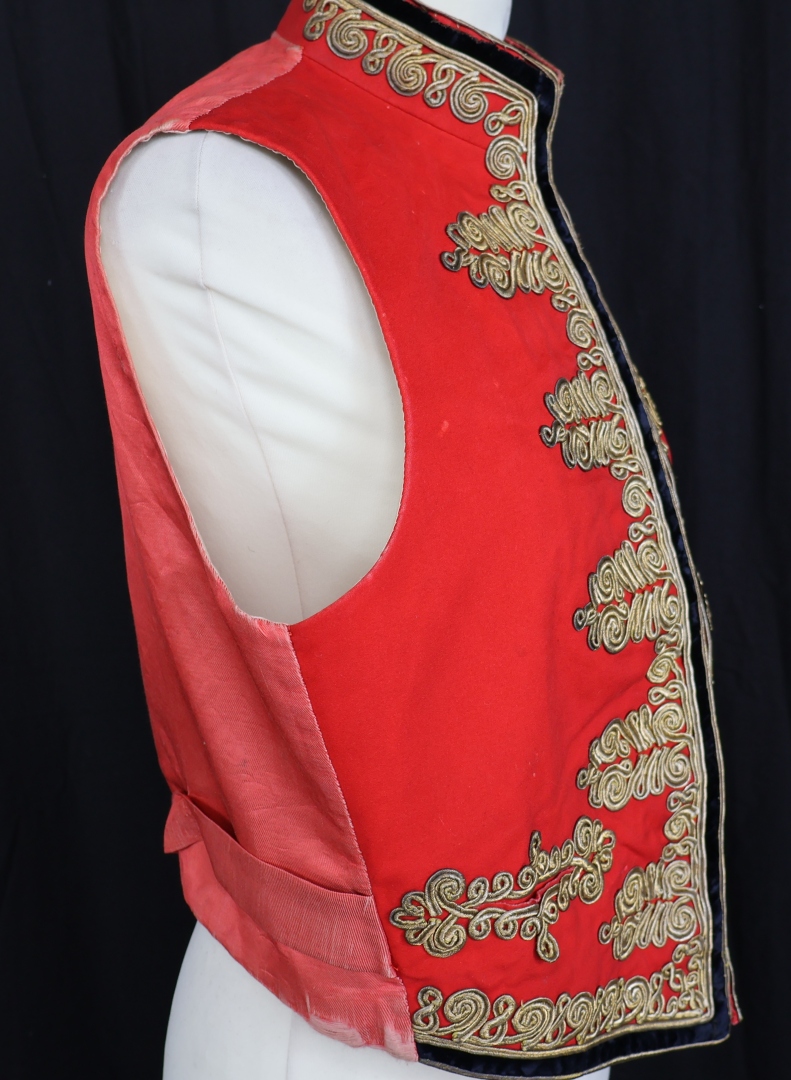 Red embroidered garment with ornate details