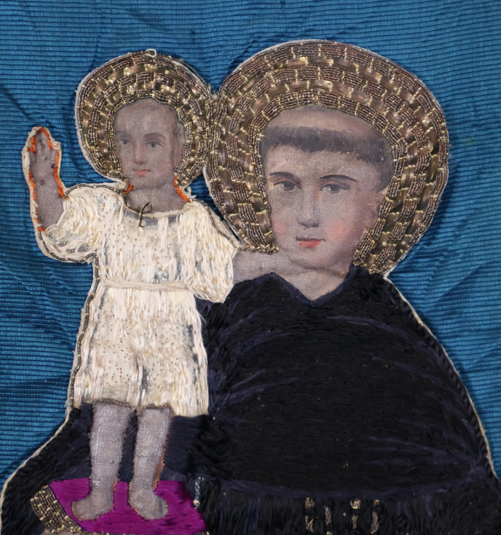 Embroidered banner with religious imagery