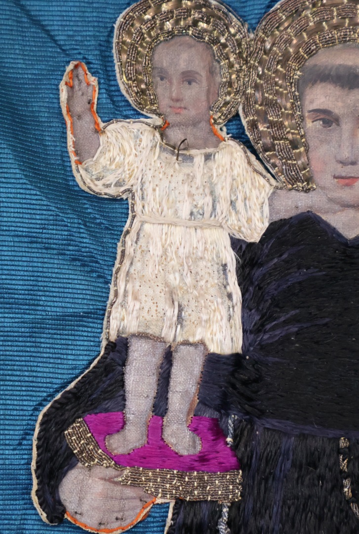 Embroidered banner with religious imagery