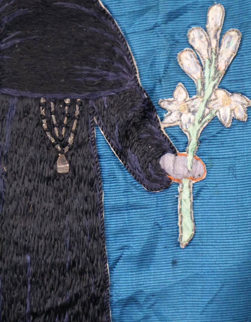 Embroidered banner with religious imagery