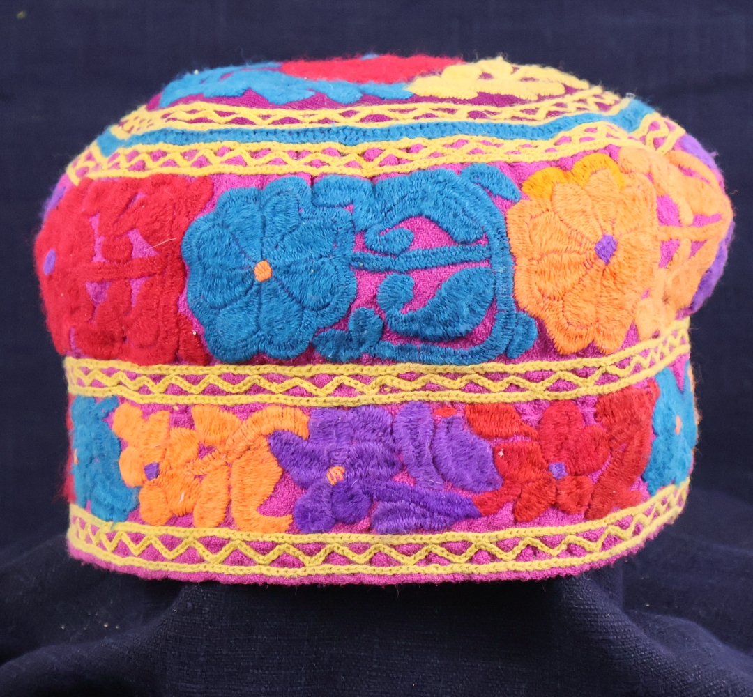 brightly coloured embroidered tribal hat